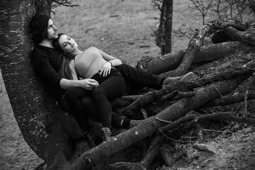 Beautiful sensual portrait of young stylish couple in love.Image of adorable brunette couple in love. Happy family.