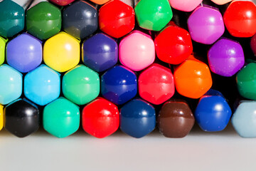 A set for a walker. Multi-colored pencils on a white background.