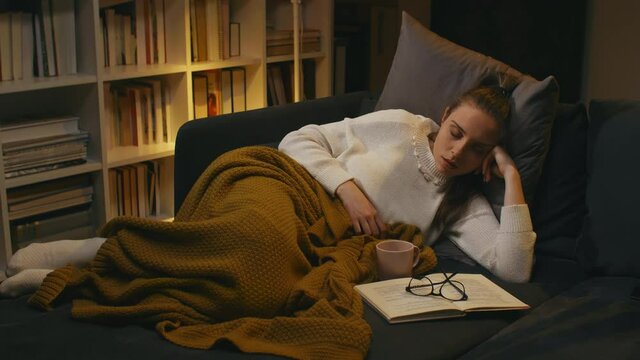 woman fell asleep while reading the book