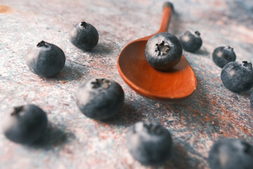Close up of fresh blue berry on spoon 