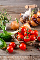 Tiny cherry tomatoes (ciliegini, pachino, cocktail). group of cherry tomatoes on wooden background. Ripe and juicy cherry tomatoes
