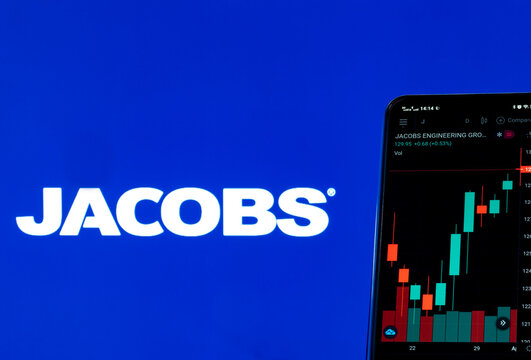 In this photo illustration the stock market information of Jacobs Engineering Group Inc. seen displayed on a smartphone with the Jacobs Engineering Group Inc. logo in the background.