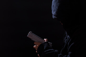 Little boy with gun. Poverty breeds crime. Child delinquency. High threshold of crime. A militarized society.