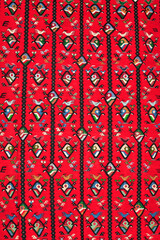 Segment of handmade carpets in bright colors