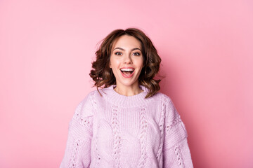 Portrait of attractive cheerful amazed wavy-haired girl having fun great news isolated on pink pastel color background