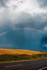 rainbow over field road