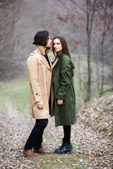 Beautiful sensual portrait of young stylish couple in love.Image of adorable brunette couple in love. Happy family.