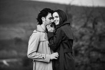 Beautiful sensual portrait of young stylish couple in love. Image of adorable brunette couple in love. Happy family.