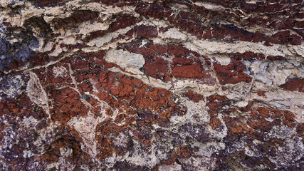 Textur der roten Erde auf einem Berg in der Nähe von Cofete auf Fuerteventura