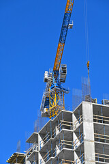 Crane and highrise construction site