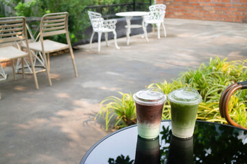 Glass of green iced sweet milk drink