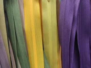 Multi-colored plastic zippers background