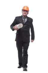 Businessman in wearing hard hat holding documents