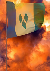 Saint Vincent and the Grenadines flag on pole with sky background