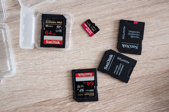 Moscow, Russia - 26 March 2021: Sandisk SD memory cards on table and microSD adapter