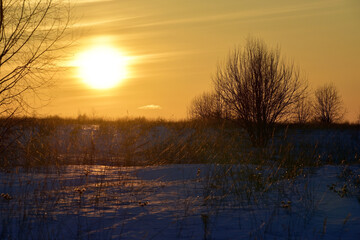 Winter sunset on the endless field