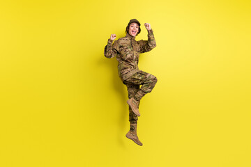 Fototapeta na wymiar Full length portrait of delighted person fists up open mouth celebrate isolated on yellow color background