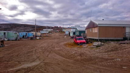 Fototapeta na wymiar Dirt road in the town of Pond Inlet, Nunavut, Canada