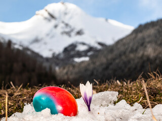 Happy Easter with easter egg and mountains