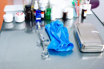 Dental instruments and medical gloves on the table