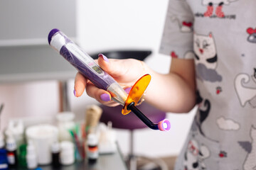 Cordless LED curing light for curing fillings. Dental equipment.