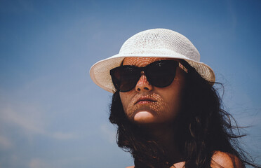 Beach vacation woman in sun smiling happy on summer holidays on tropical beach.