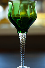 green vintage wine glass close-up. antique wine glass