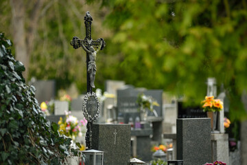 Cemetery with tombstones in the shape of a cross, angels. Many decorated graves