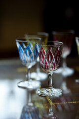 set of colored antique engraved glasses. glass vintage wine glasses