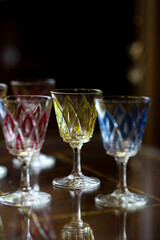 set of colored antique engraved glasses. glass vintage wine glasses