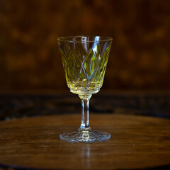 yellow crystal antique engraved shot glass close-up. glass retro shot