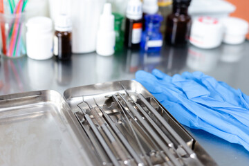 Dental instruments and medical gloves on the table