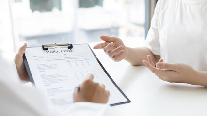 Patients explain their symptoms to the doctor, Specialist doctors advise and examine the history of patients in a direct health room at a modern hospital, Annual Health Check and Health Care Report.