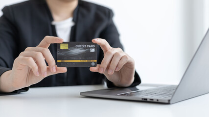 Online product purchase, Businesswoman use laptop register via credit cards to make online purchases, Shopping and mail, credit card online security, Online shopping concept.