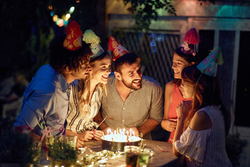 A young girl, friends and birthday wishes at the open air birthday party. Quality friendship time together