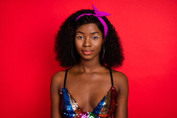 Photo of sweet adorable wavy dark skin lady wear pin up outfit smiling isolated red color background