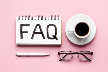 FAQ web communication concept. Text on notebook. top view