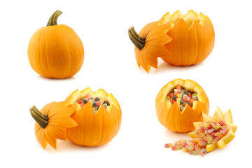 An orange Halloween pumpkin cut open and some filled with candy on a white background
