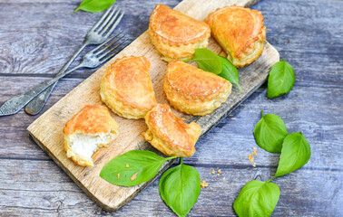 Fresh baked home made  Mini cheese puff pastries.Cheese pie with phyllo pastry and herbs
