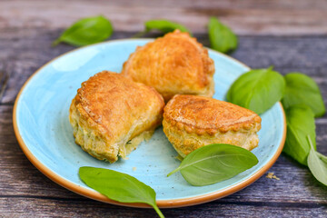 Fresh baked home made  Mini cheese puff pastries.Cheese pie with phyllo pastry and herbs