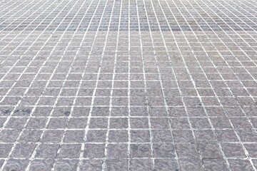 Fototapeta premium Perspective View Monotone Gray Brick Stone Pavement on The Ground for Street Road
