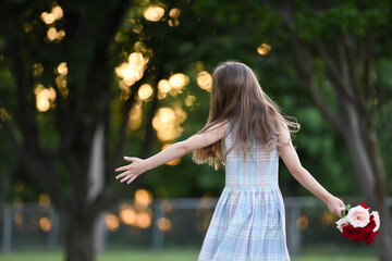 A girl in a dress with flowers