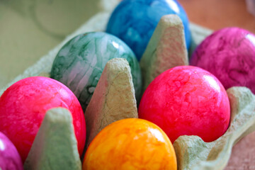 Colorful Easter Eggs in an egg carton.