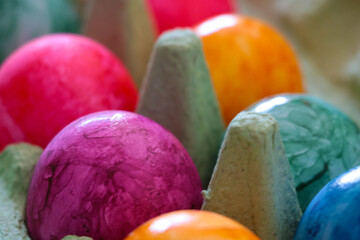 Obraz na płótnie Canvas Easter colored eggs in a cardboard box.