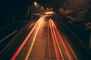 Fototapeta na wymiar Light Painting - Night - Winter-fog-Cyberpunk style-long exposure-road
