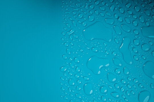 Water Drops on Blue Background. World Water Day Concept. Droplet Texture Surface. Environment Care. CSR, Corporate Social Responsibility or CSC, Corporate Social Contribution