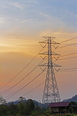 Fototapeta premium High voltage electricity poles at sunset