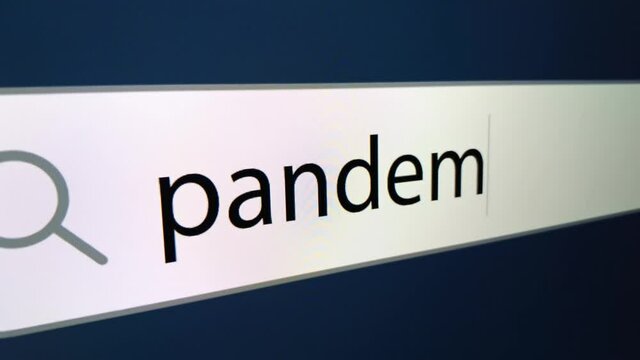 Pandemic is written in the line of the Internet browser. Slow zooming on the monitor screen