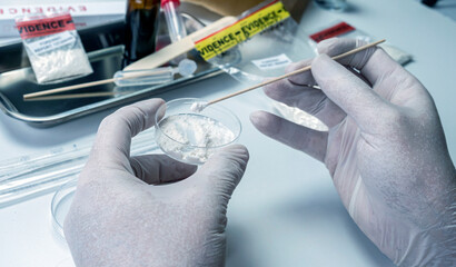 police scientist making drug test in crime lab, conceptual image
