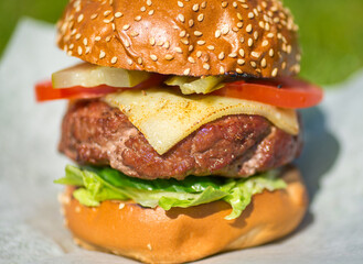 Delicious burger stacked high with a juicy beef